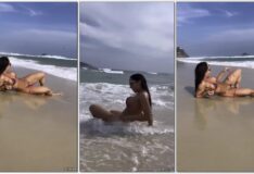 Mulher Melão fazendo um topless na praia